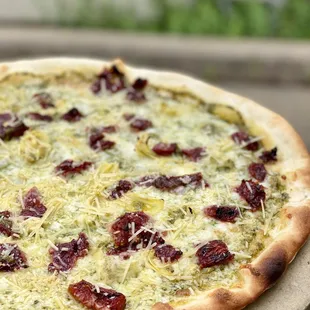 The Okie Dokie. Artichokies, Marinated Sun Dried Tomatoes, House Made Pesto &amp; Mozzarella.