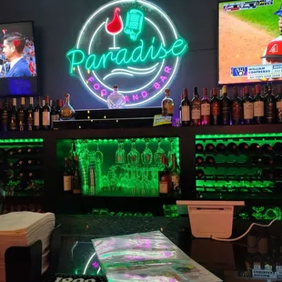 a bar with neon signs
