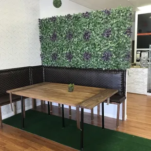 Big booth with garden wall.  Not real but nice decorator touch