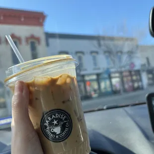 Iced vanilla latte with oatmilk.