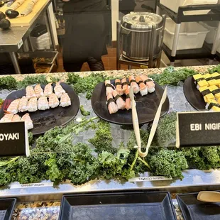 a variety of sushi on display