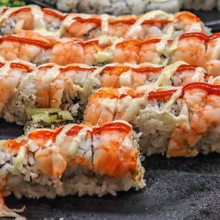 a plate of sushi rolls