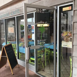 the entrance to paradise cafe