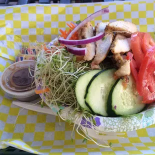 Veggie salad with grilled chicken and a side of balsamic vinaigrette - the bowl makes it look smaller than it is!