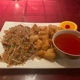 a plate of chinese food and a cup of tea