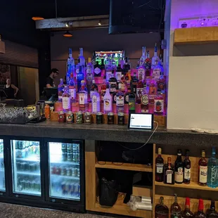 a bar with a variety of liquors
