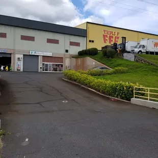 View from Moanalua Road. Located right next to Triple F building. The drive-way is on the right just before the West bound on-ramp.