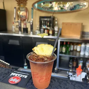 a drink with a pineapple garnish