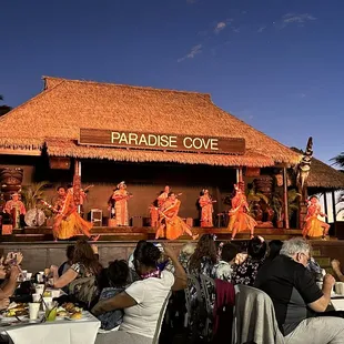 a group of people performing on stage