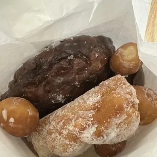 Banana fritter, sugar twist, devil's food, and complementary donut holes!