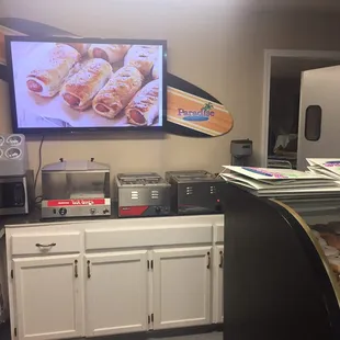 a kitchen with a flat screen tv