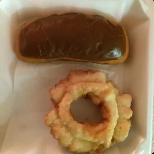 a chocolate donut and onion rings