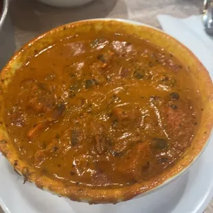 a bowl of stew and a bowl of rice