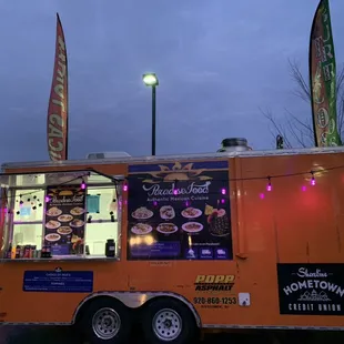 a food truck parked in a parking lot