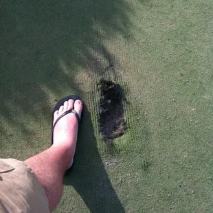 A hole in the green the size of my foot.
