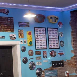 a blue wall with a lot of stickers on it