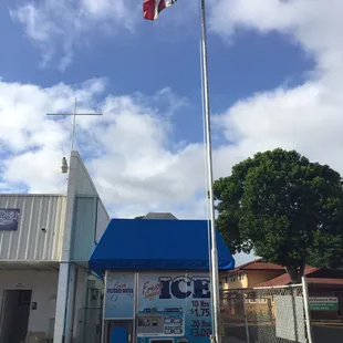 an american flag flying in front of a building