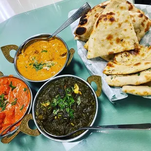 Butter chicken, lamb korma, saag paneer, and plain and garlic naan