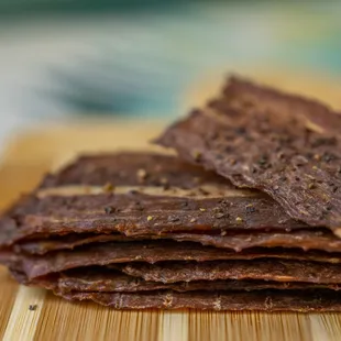 a stack of flatbreads on a cutting board