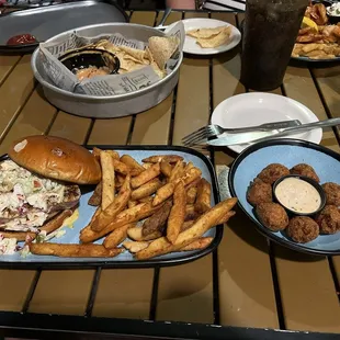 Ahi tuna burger with mango coleslaw, fries and hushpuppies  it was delicious