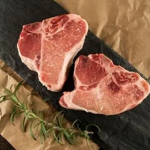 two steaks on a cutting board