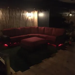 a living room with a red couch