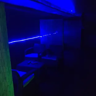 a dark room with blue lighting