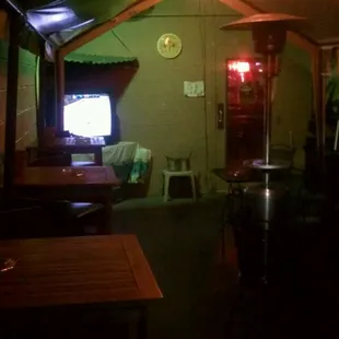 Outdoor Smoking Patio with TV and Music from Jukebox. Heaters during winter, misters during summer.