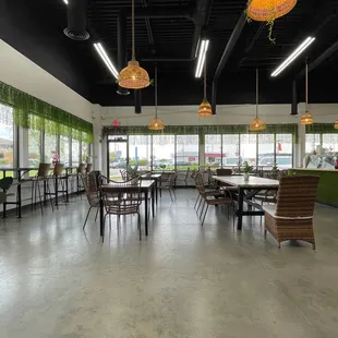  a restaurant with tables and chairs