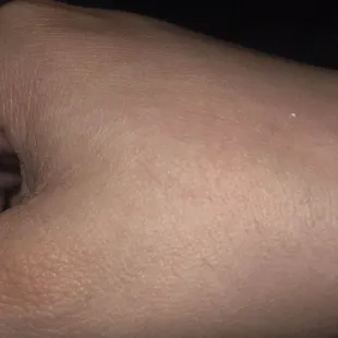 a person's hand holding a cell phone