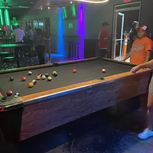 a man playing a game of pool