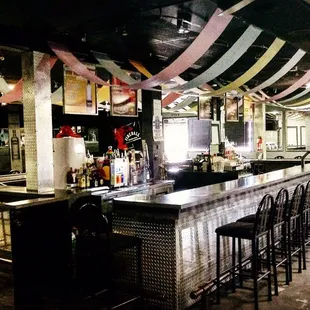 Paradise' horseshoe shaped bar catering to both dance floor and pool tables.