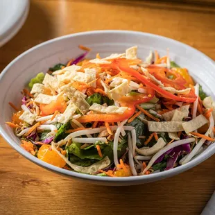 a bowl of salad on a table