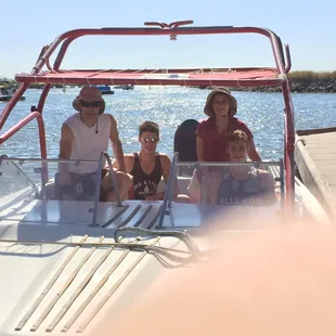 The A-C family in a ski boat on the Delta.