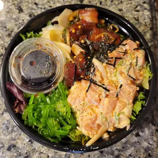 Spicy salmon and shoyu tuna on greens
