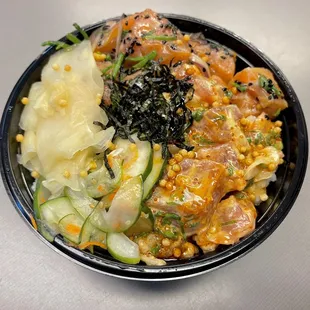 Truffle Ponzu Salmon and Spicy Ahi poke bowl with yuzu cucumber and unagi sauce