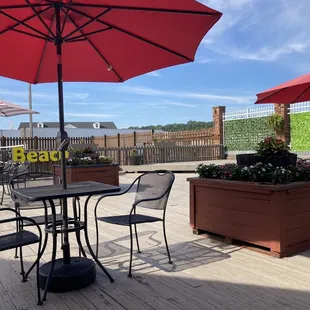 Outside dining with volleyball in background.