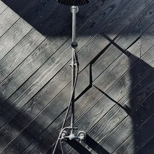 Outdoor shower on mirror house .