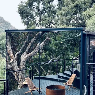 The view of limitless House and the fire pit hidden in nature .