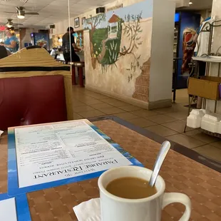 a cup of coffee on a table