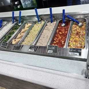 a variety of salads in a buffet