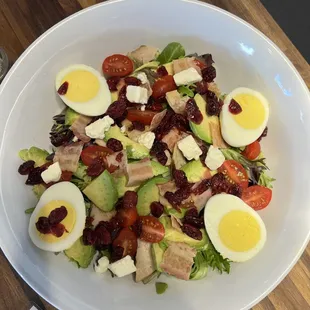 a salad with hard boiled eggs and bacon