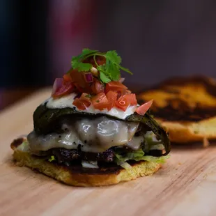 Beach house- 2 Pattie&apos;s, roasted green chili, smoked mozzarella, pico de gallo, &amp; jalapeño ranch.