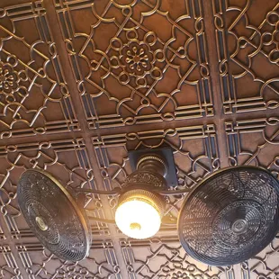 Copper ceiling with rotating fans