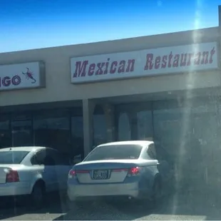 cars parked in front of a mexican restaurant