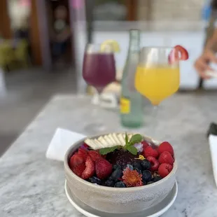 a bowl of fruit on a table