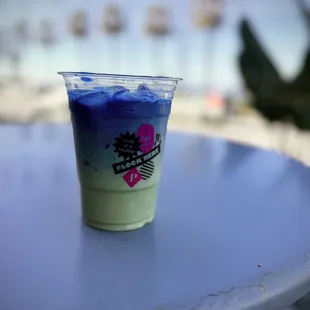 a plastic cup with blue liquid