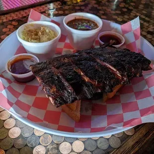 a plate of ribs and sides