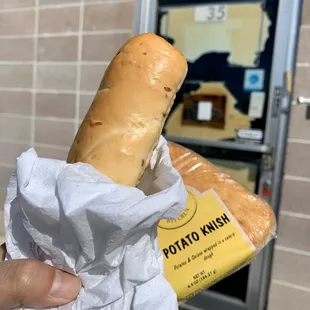 Complimentary jalapeño and cheese bagel dog and potato knish