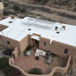A silicone-coated roof looking immaculate under the bright Albuquerque sun.